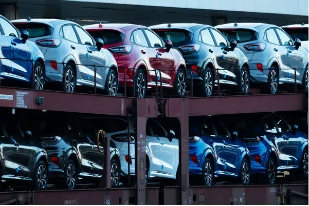 parked cars in a line in a car yard